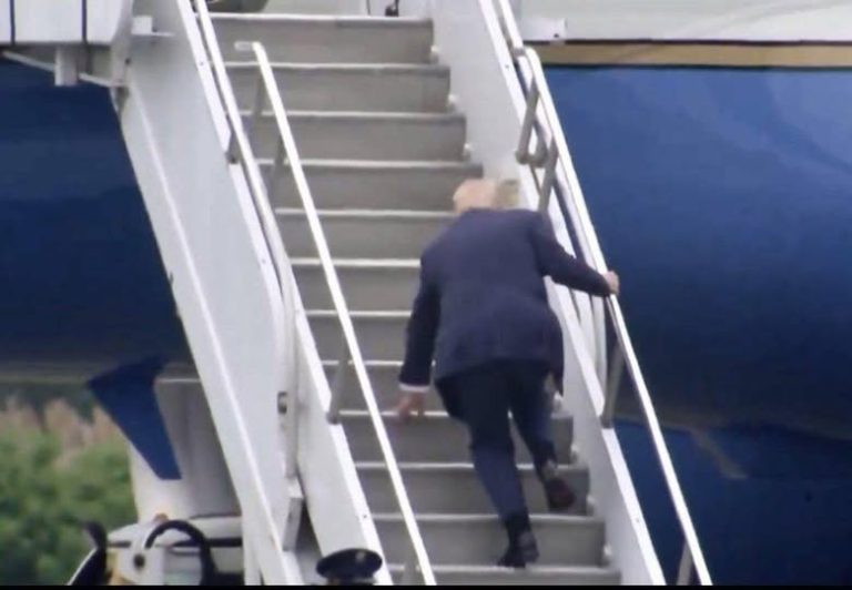 Donald Trump falls on the stairs while